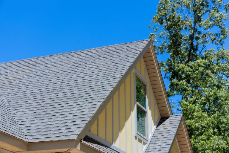 gray roof on yellow house