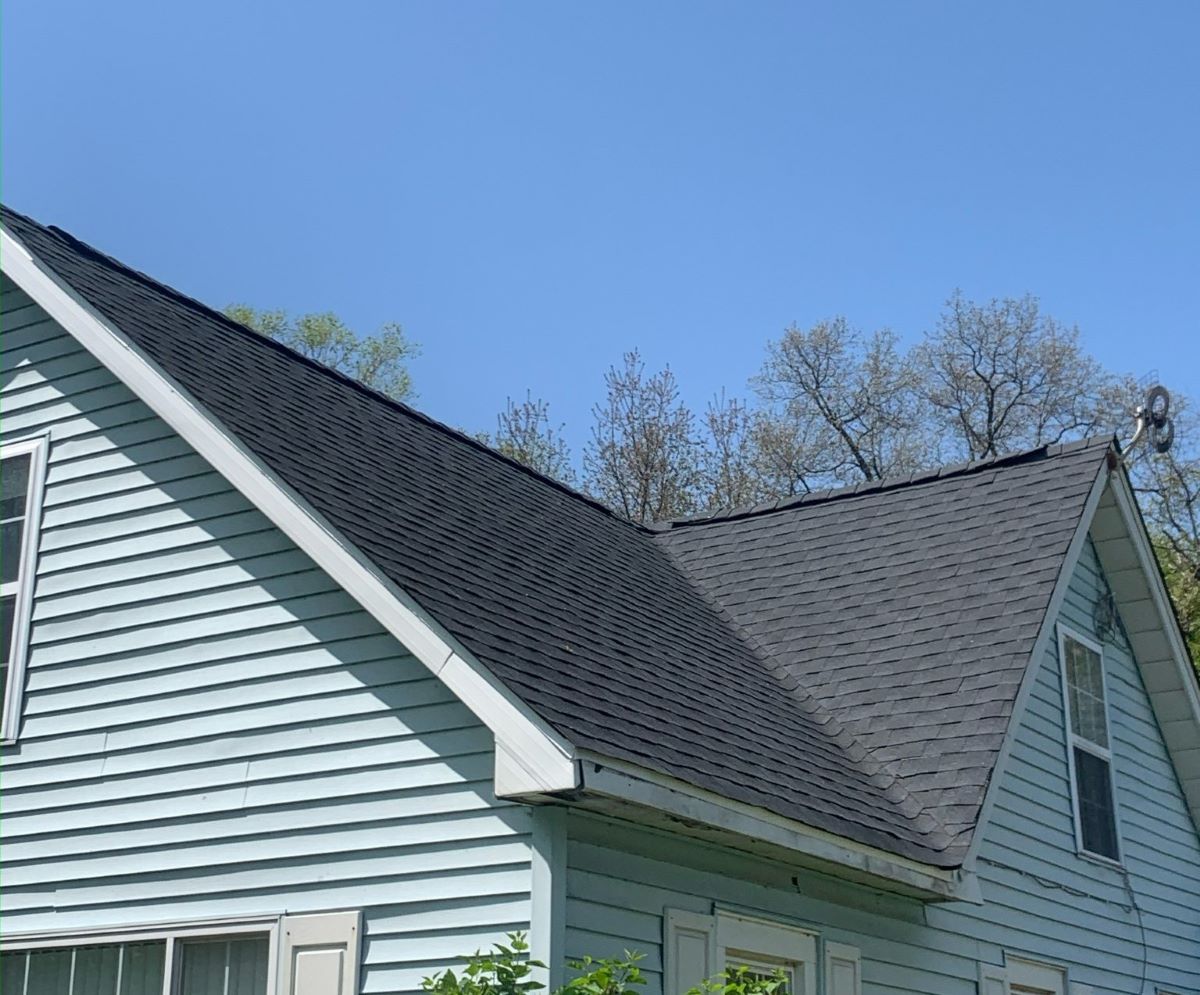 blue house with asphalt shingle roof