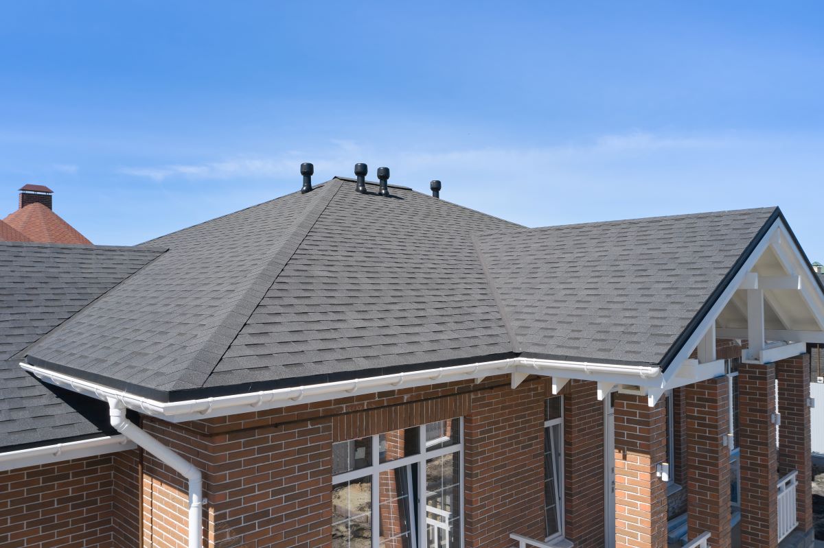 brick house with asphalt shingle roof