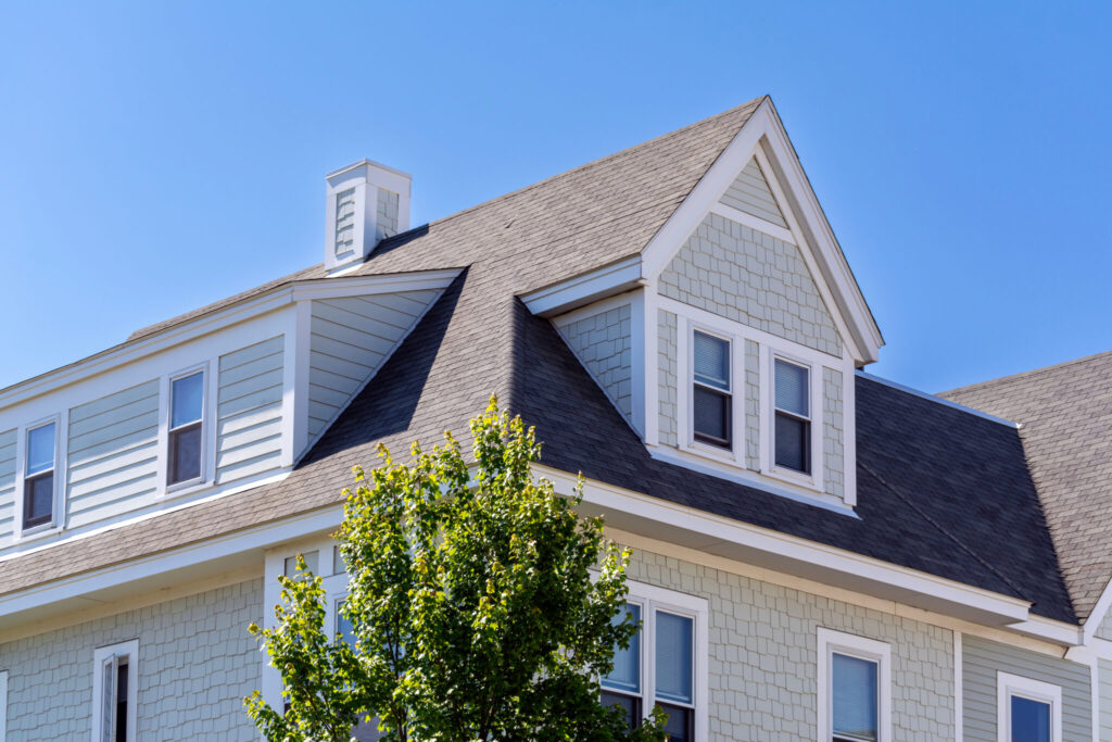 siding on family home and asphalt shingles