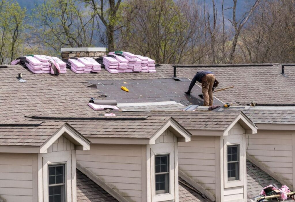 man preparing to replace roof