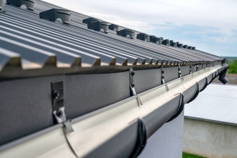 Gutter system for a metal roof. Holder gutter drainage system on the roof