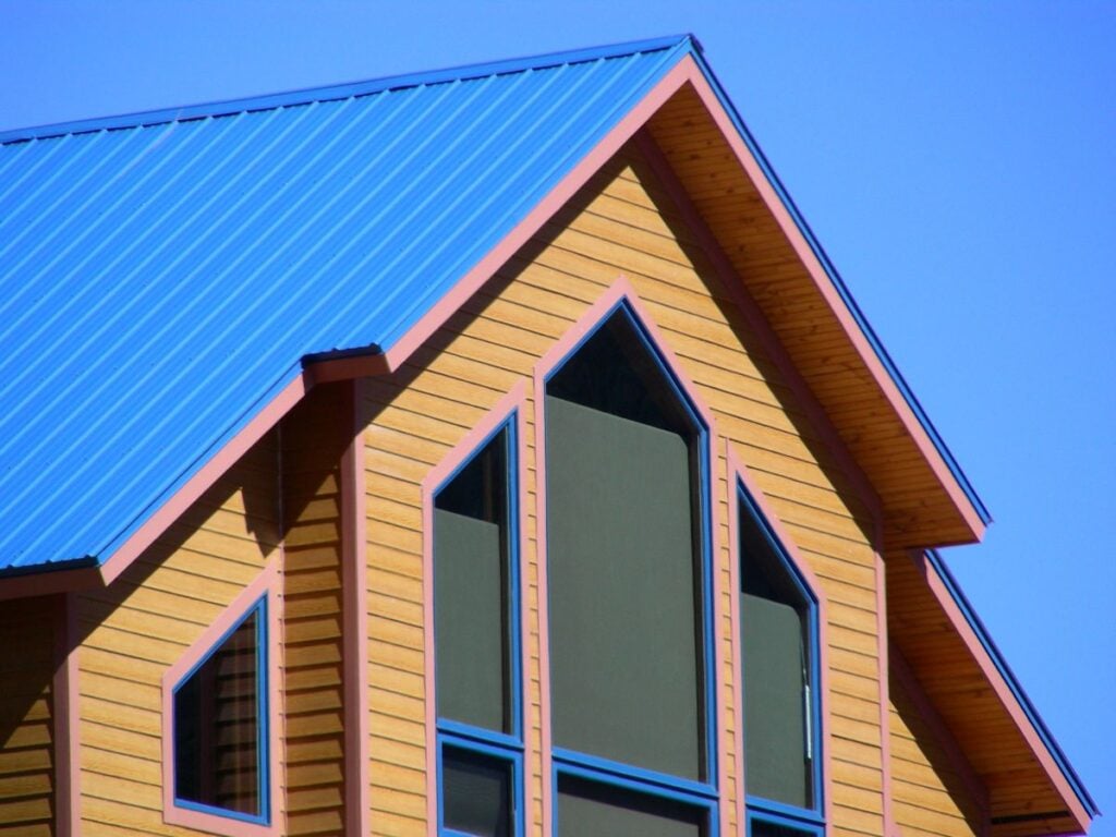 metal roof installation blue lines brown siding
