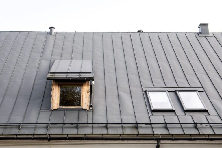 metal roof maintenance grey roof two windows