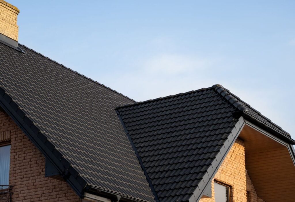 roof warranty black metal roofing brick house