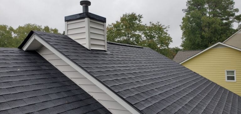 black shingles big roof new house