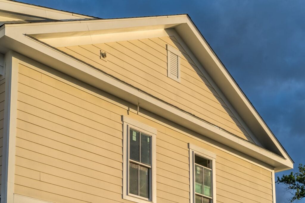can you paint vinyl siding yellow house white roof edge