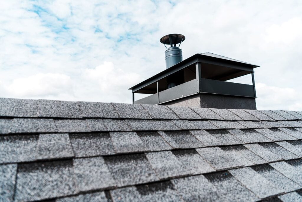 metallic chimney rain cap modern cap grey shingles roof
