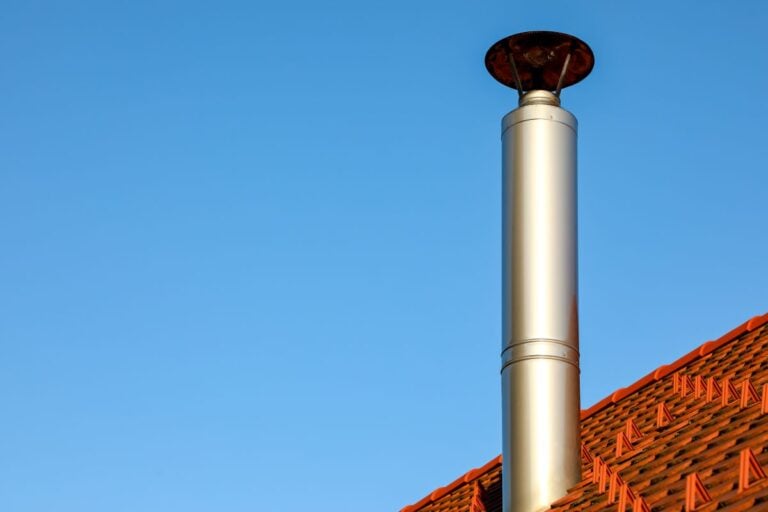 roof vent cap orance ceramic tiles blue sky