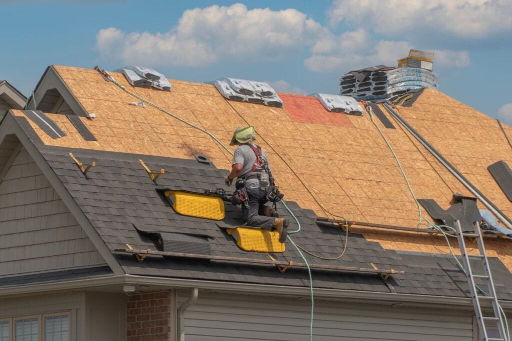roof vent cap worker replacing roof
