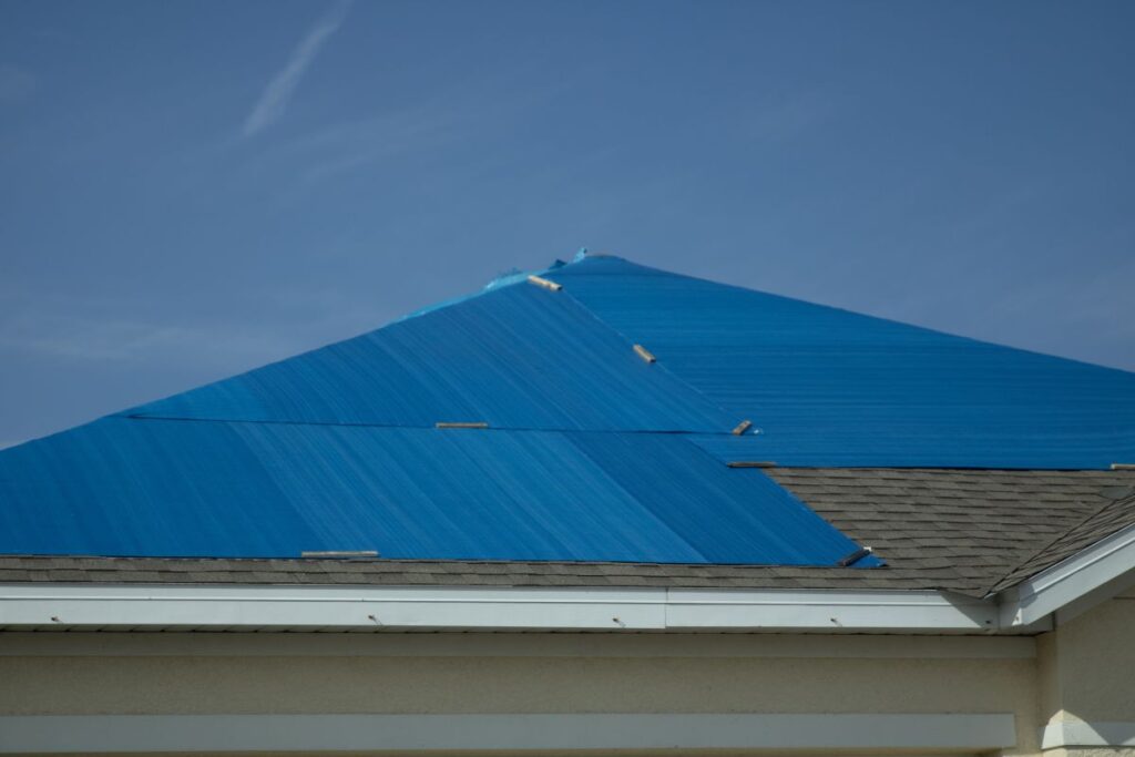 tarp on a roof after storm damage