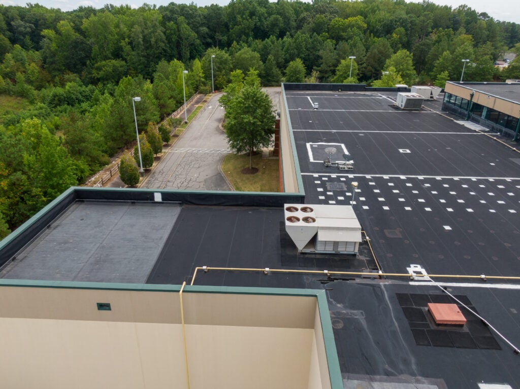 commercial flat roof replacement black bitumen small building