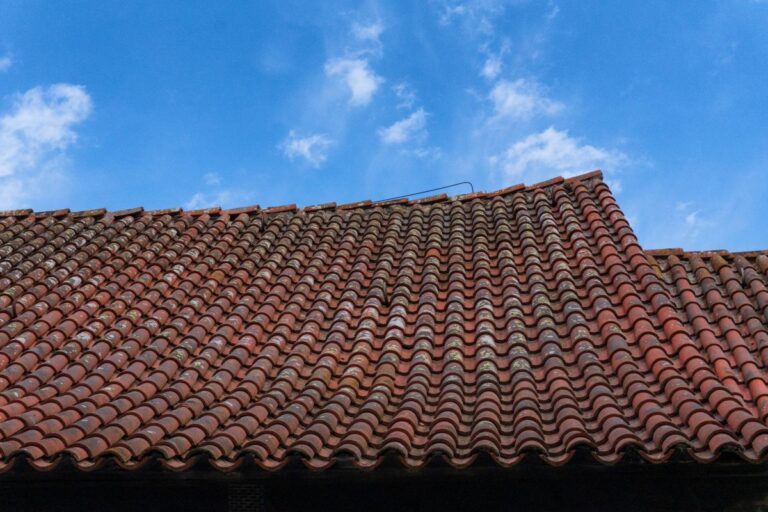 sagging roof orange tiles damaged