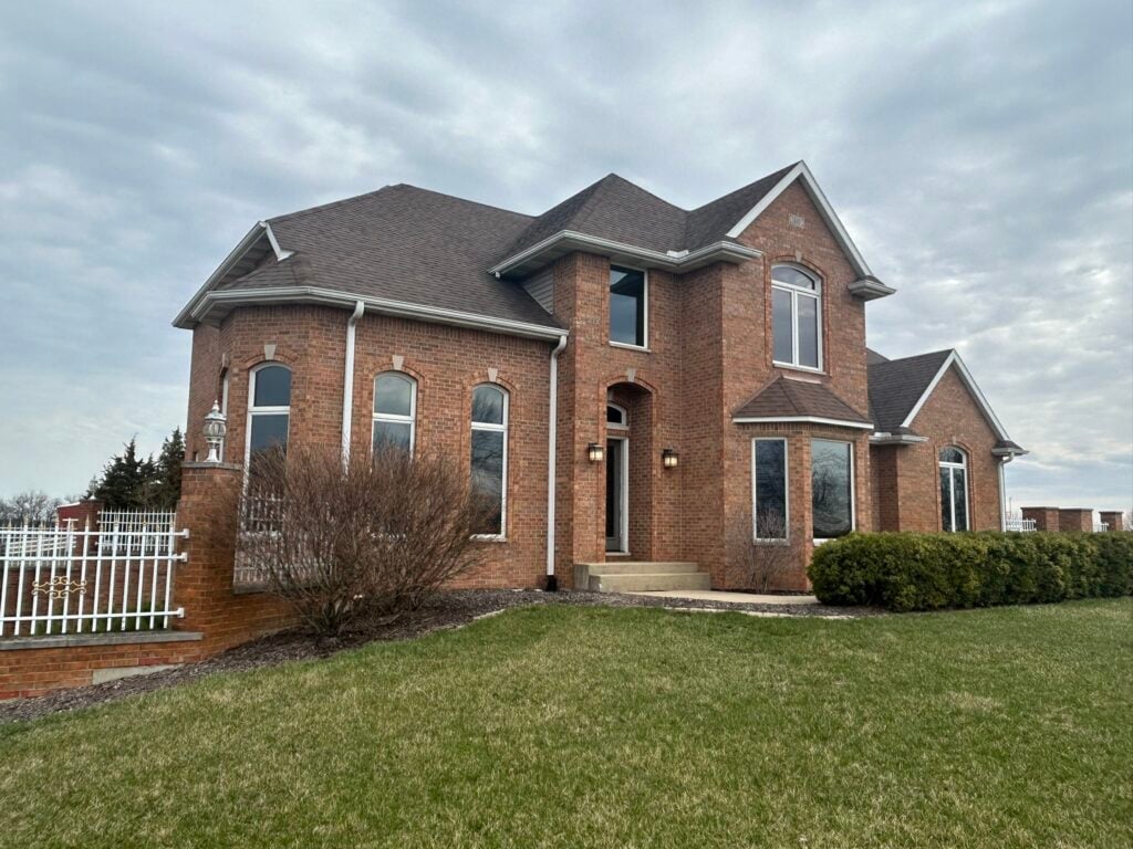 gutter guard types shingle roof and brick walls