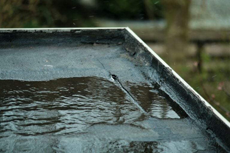 does homeowners insurance cover roof leaks black bitumen flat roof with water pond